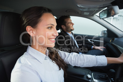 Business team smiling and driving