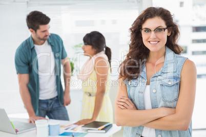 Portrait of pretty woman in front of colleagues