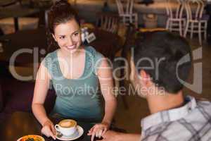 Young couple having coffee together