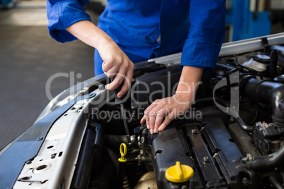 Mechanic working under the hood