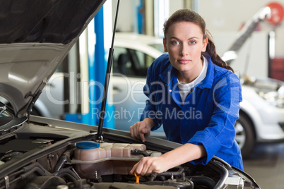 Mechanic working under the hood