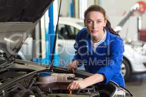 Mechanic working under the hood