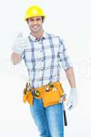 Male handyman gesturing thumbs up sign