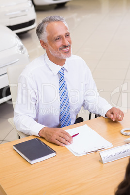 Happy businessman working at his desk