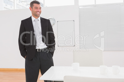 Posing businessman at his desk