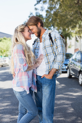 Attractive couple standing and hugging