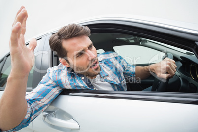 Young man experiencing road rage