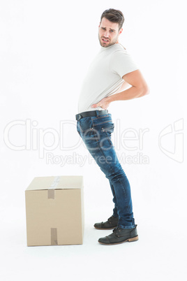 Portrait of delivery man suffering from back ache