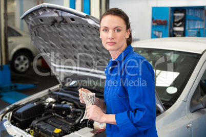 Mechanic wiping hands with rag