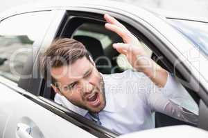 Businessman experiencing road rage