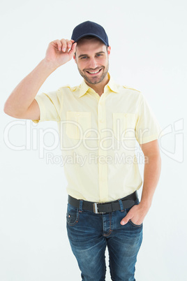 Happy delivery man wearing baseball cap