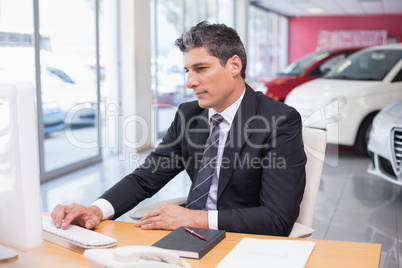 Focused businessman using his laptop