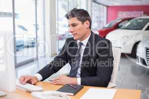 Focused businessman using his laptop