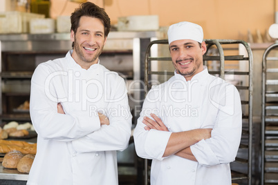 Smiling bakers looking at camera