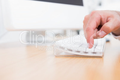 Businessman pushing key on keyboard