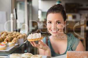 Pretty brunette holding lemon meringue pie