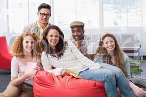 Fashion students smiling at camera together