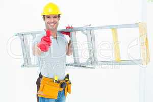 Worker carrying step ladder while showing thumbs up