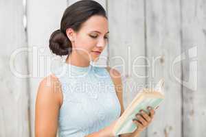 Stylish brunette reading a book