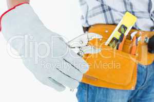 Technician using pliers over white background
