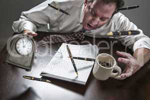 Stressed Man At Desk, Pens, Coffee, Glasses, Clock Flying Up