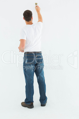 Man painting on white background