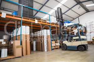 Forklift machine in a large warehouse
