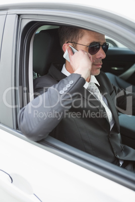 Businessman on the phone wearing sunglasses