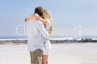 Cute couple hugging on the beach