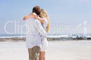 Cute couple hugging on the beach