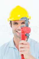 Handyman holding monkey wrench against white background