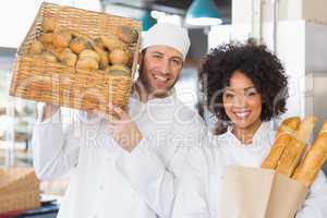 Team of bakers smiling at camera