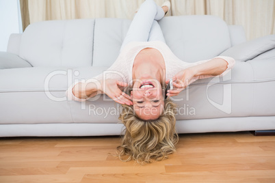 Pretty blonde on couch laughing on the phone