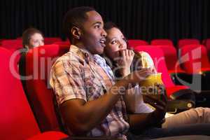 Young couple watching a film