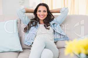 Pretty brunette relaxing on the couch