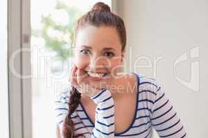 Pretty brunette smiling at camera