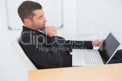 Relaxed businessman with a laptop