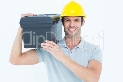 Happy worker carrying tool box on shoulder