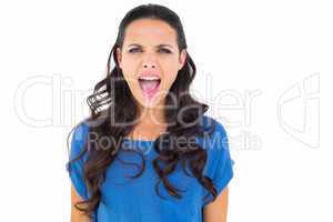 Angry brunette shouting at camera