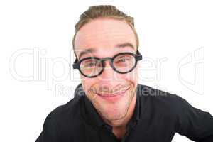 Businessman with reading glasses making a face