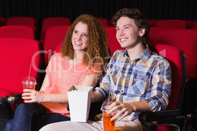 Young couple watching a film