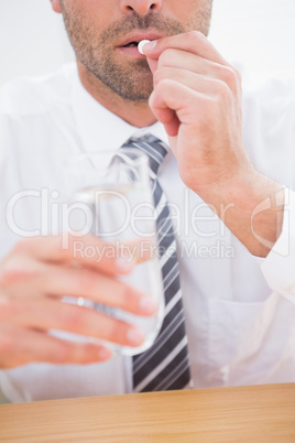 Casual businessman taking a tablet