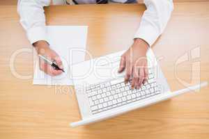 Businessman typing on computer keyboard