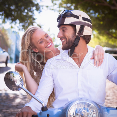 Cute couple riding a scooter