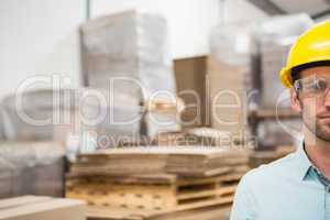 Close up of worker wearing hard hat in warehouse