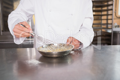 Close up of baker preparing a pastry