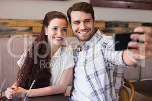 Cute couple on a date taking a selfie