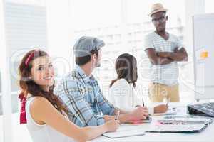 Colleagues listening businessman and taking notes