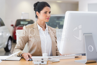 Focused businesswoman working on computer