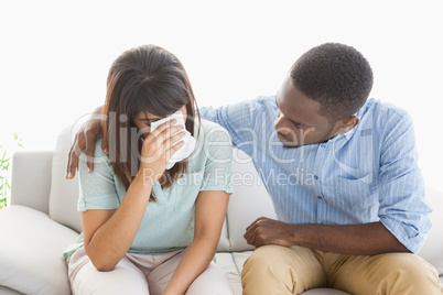 Worried woman being comforted by her therapist